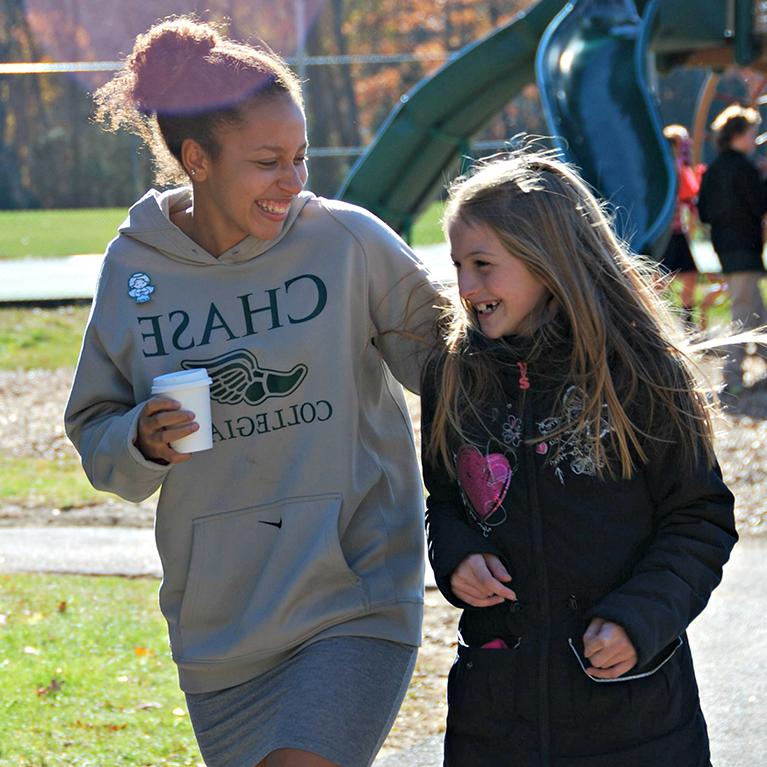 Chase Collegiate students laughing near playground